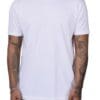 White t-shirt worn by tattooed individual.