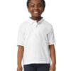Smiling child wearing a white polo shirt.